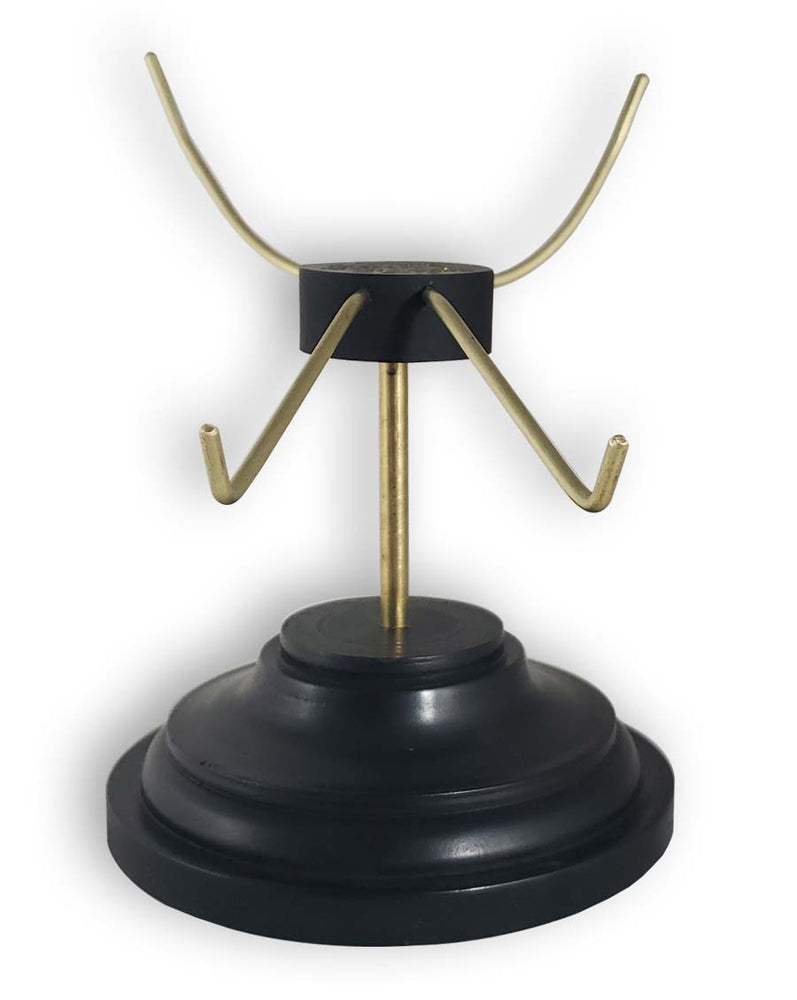 
                  
                    Skull stand with black base and brass tines front view.
                  
                