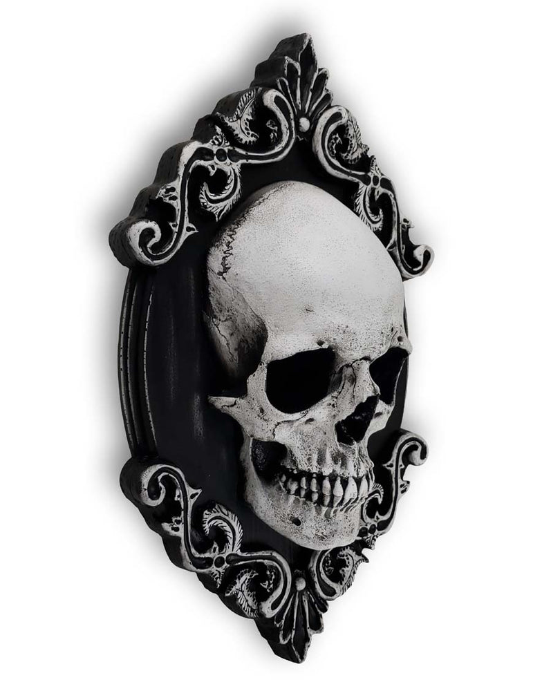 
                  
                    Skull Plaque large wall décor with filigree design facing right. 
                  
                